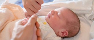 taking blood from a newborn